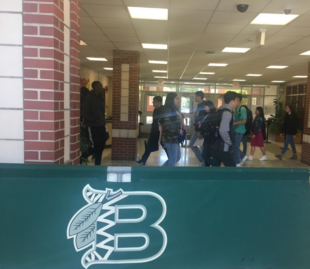 Students take a detour due to a blocked hallway.