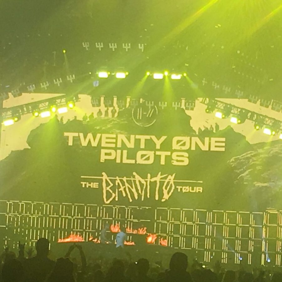 Yellow lights dazzle the crowds at Twenty One Pilots Bandito concert.