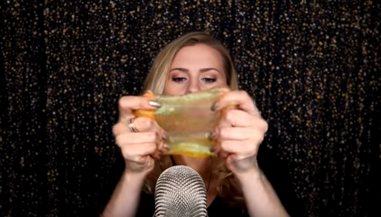 A slime-pressing ASMR Video featured on YouTube under the Gentle Whispering channel.