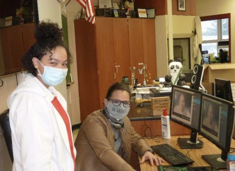 Dr. Grella poses with one of her science research students.