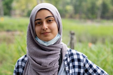 Nabihah Ahsan poses at the beach while conducting her summer research.