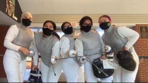 The members of the girls Varsity Fencing Team pose with their sabers.