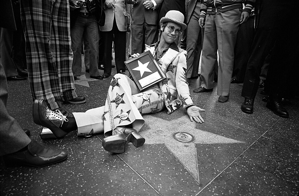 Elton John receiving his star on the Hollywood Walk of Fame, Hollywood. This photo is derived from Wikimedia Commons. License details: https://creativecommons.org/licenses/by/4.0/deed.en