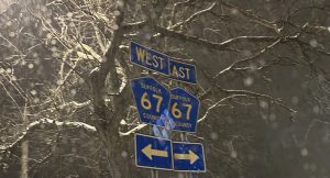 “Suffolk 67 county” West and East signs.